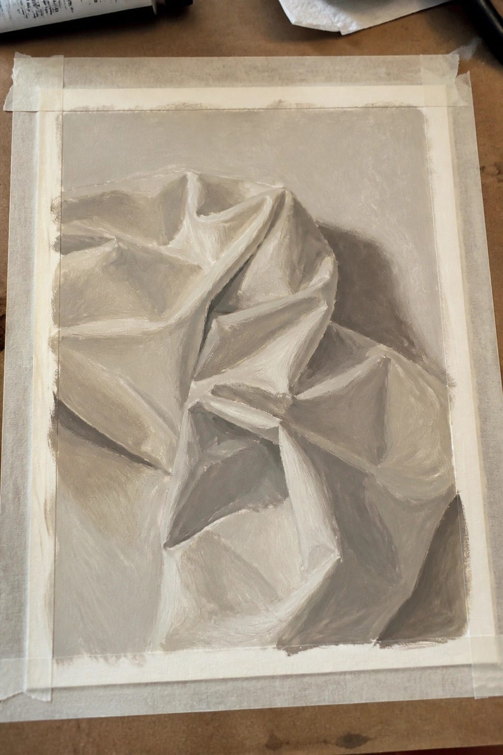 Monochrome painting of crumpled paper folds taped to a surface