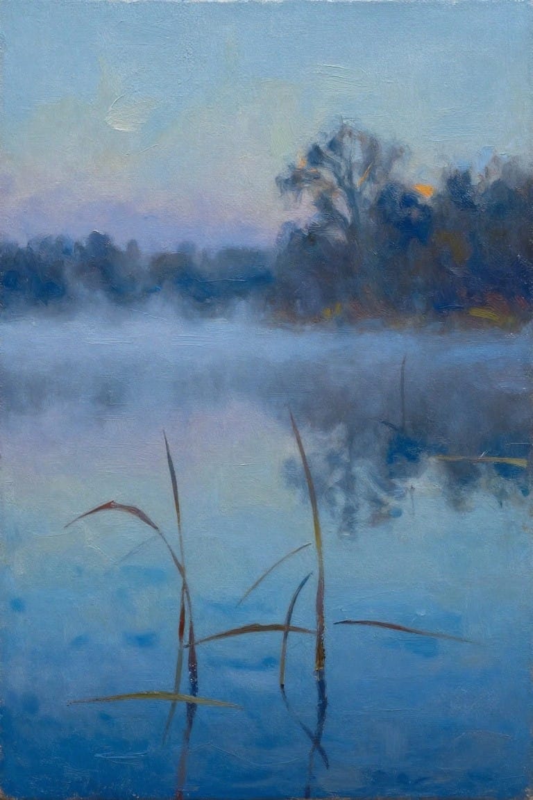 Misty blue waterscape with tall reeds in foreground and hazy distant trees