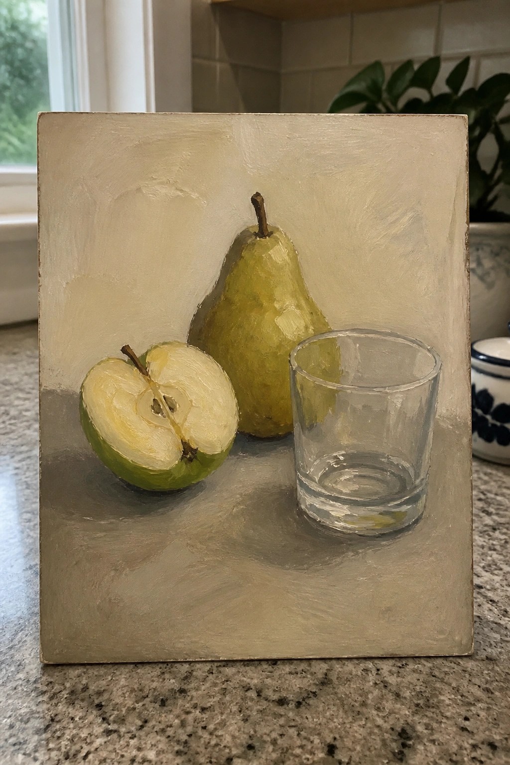 An oil painting of a whole green pear, a cut green apple, and a clear glass on a neutral surface.