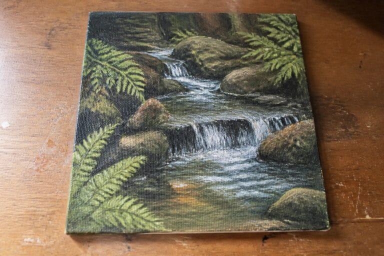 20 Scenic River and Waterfall Oil Painting Ideas to Practice Flowing Water Painting of forest stream with waterfall, mossy rocks and green ferns on wood