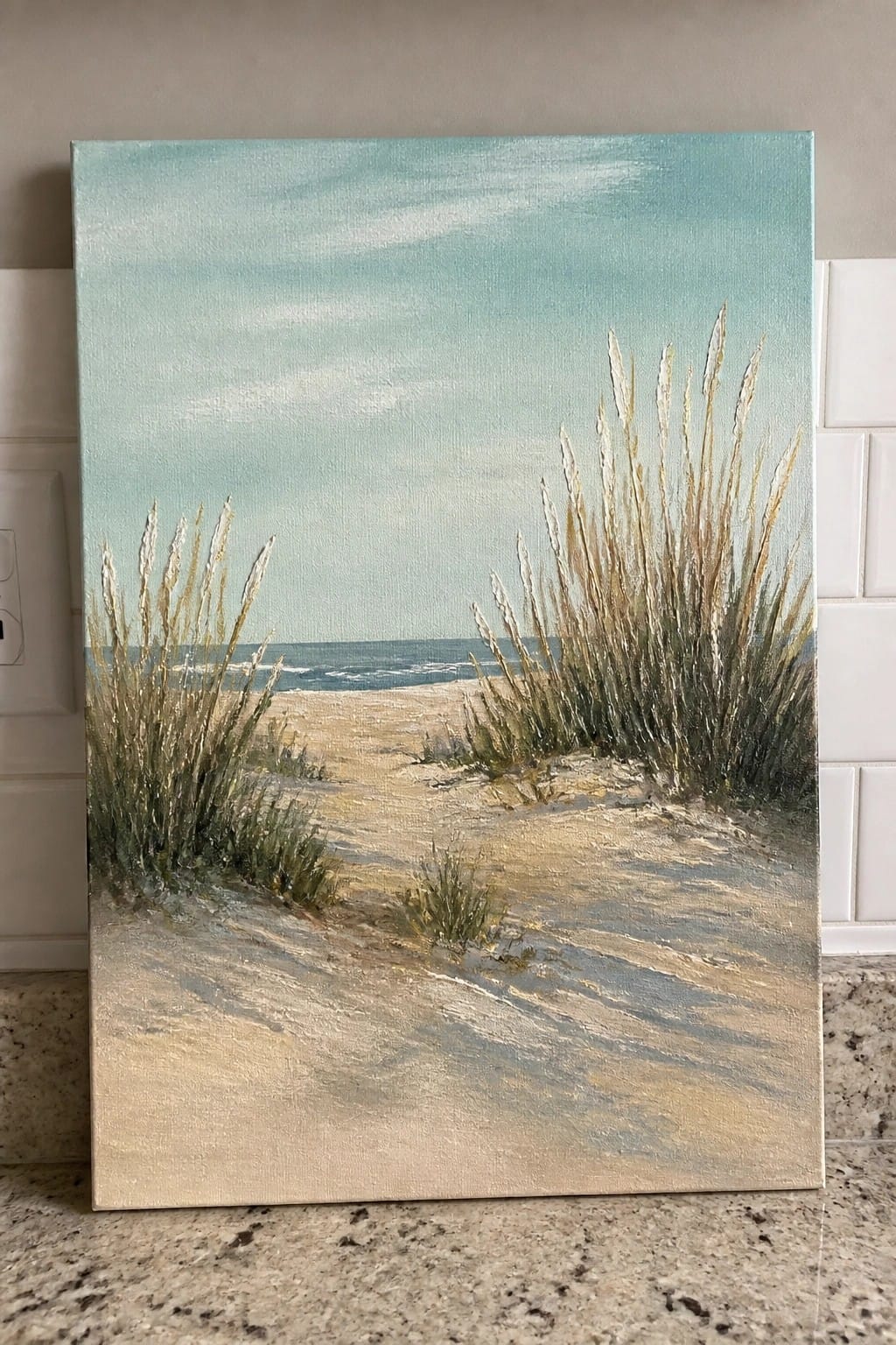 Realistic painting of sandy beach path with tall grasses leading to ocean.
