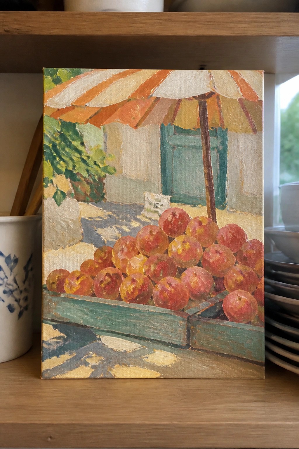 Impressionist painting of red peaches in green crates under striped umbrella on shelf