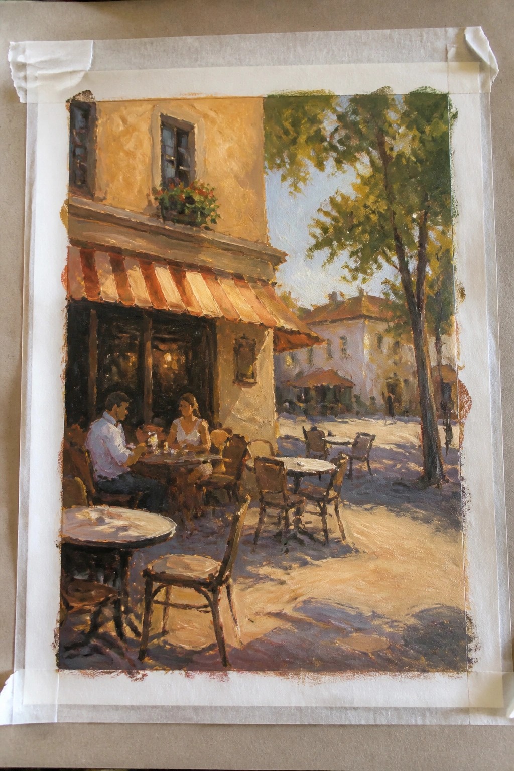 Impressionistic painting of couple seated at sunny café under red-striped awning with empty chairs and trees.