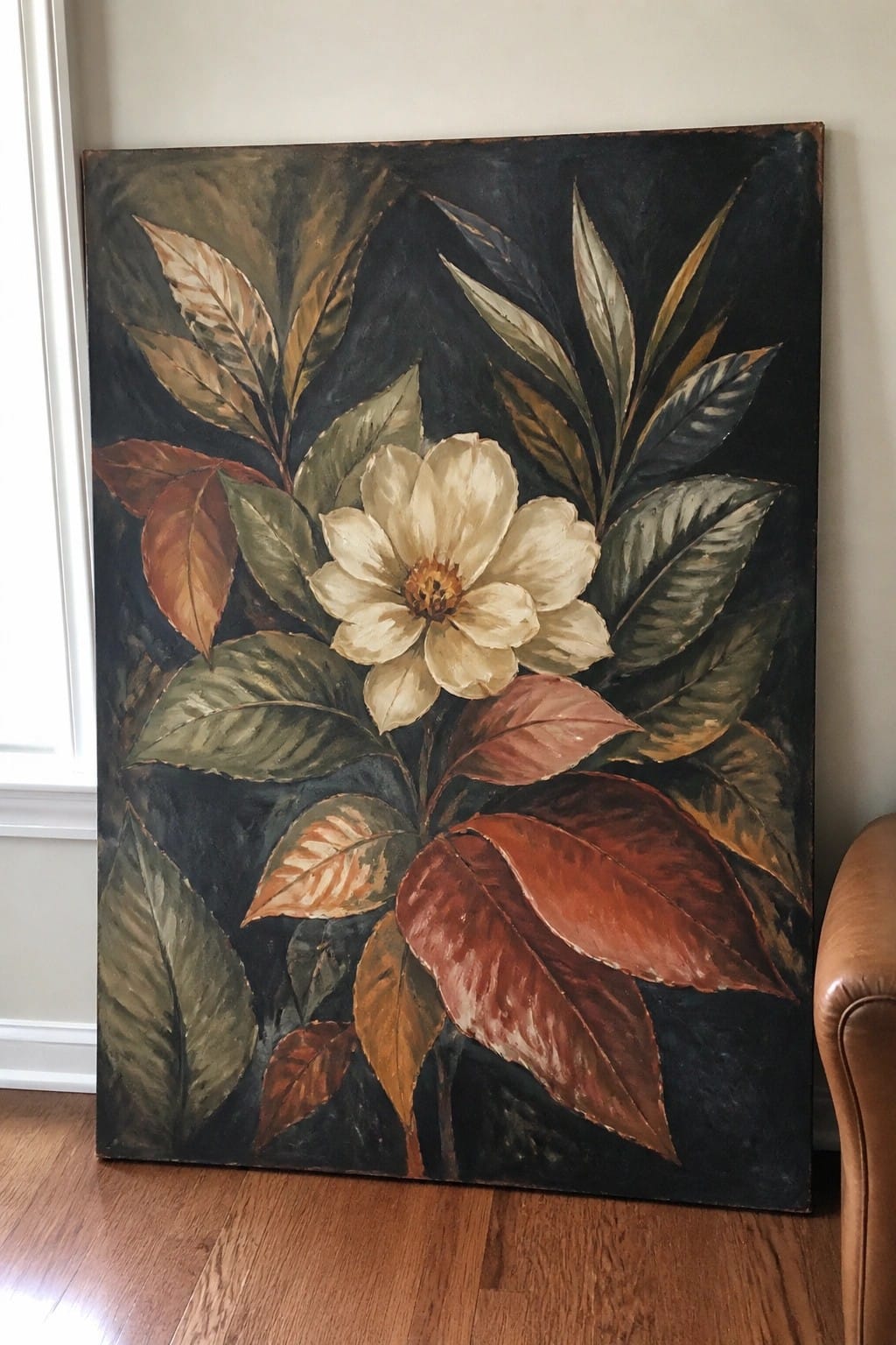Large painting of white flower with green, brown and red leaves on dark background