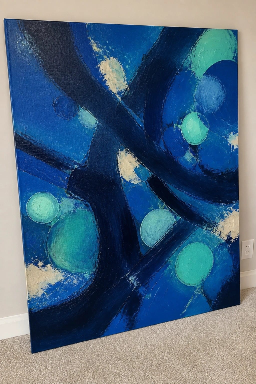 Abstract blue painting with bold dark strokes and scattered turquoise circles on canvas