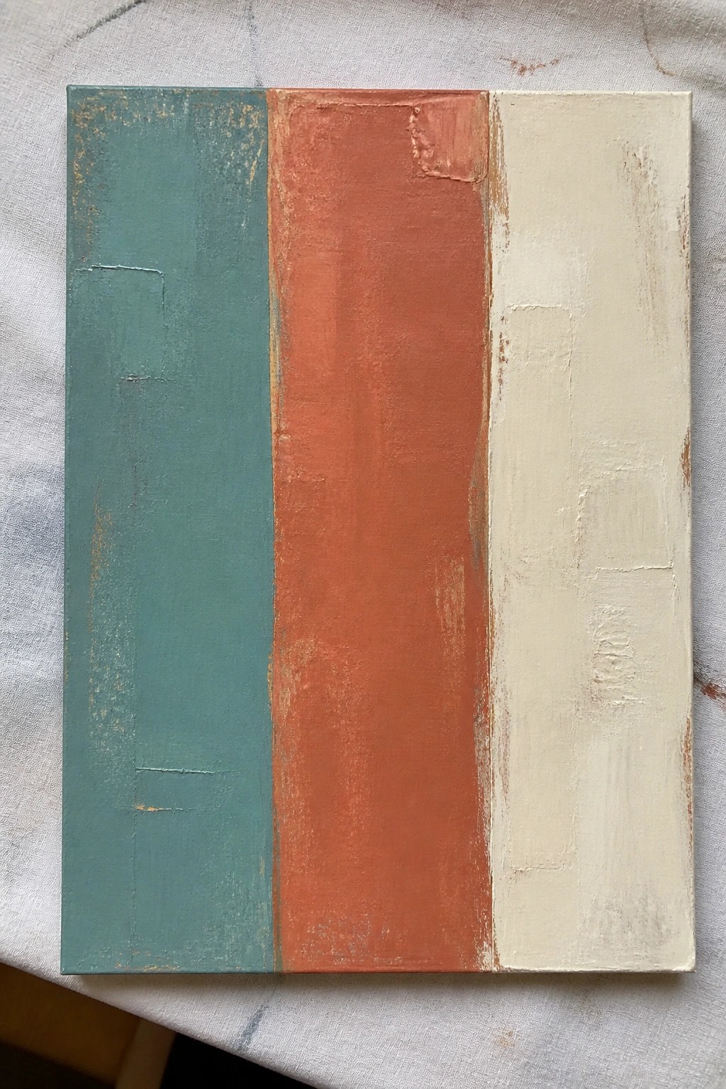 Abstract painting with vertical teal, orange, and cream textured panels on canvas