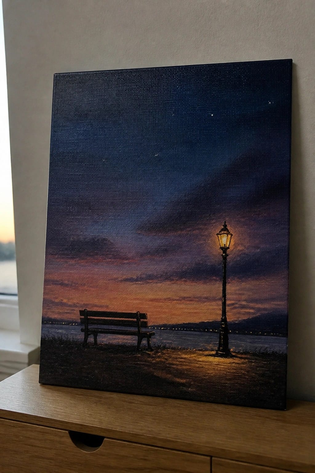 Realistic canvas painting of bench and glowing lamppost by water under starry twilight sky