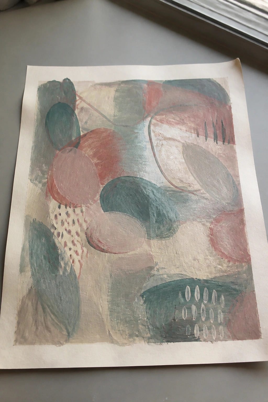 Abstract painting of overlapping teal, red, and pink organic shapes with dotted patterns.