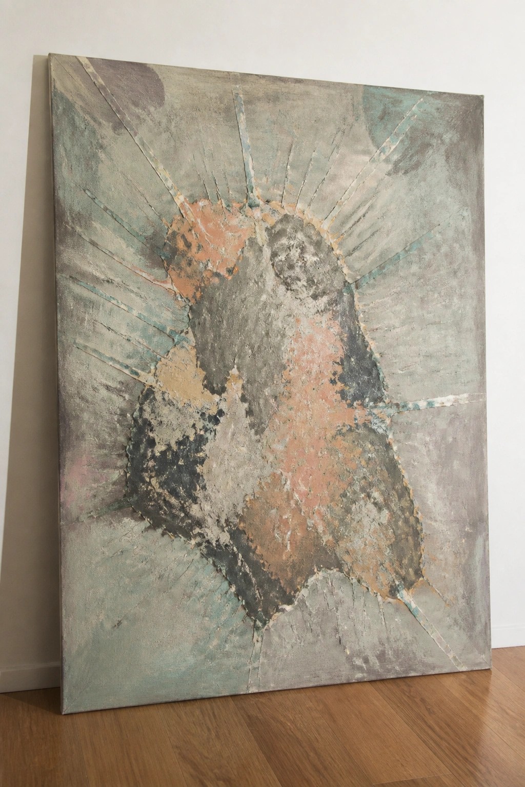 Large abstract painting with radiating lines and textured coral, teal, and gray layers on floor.