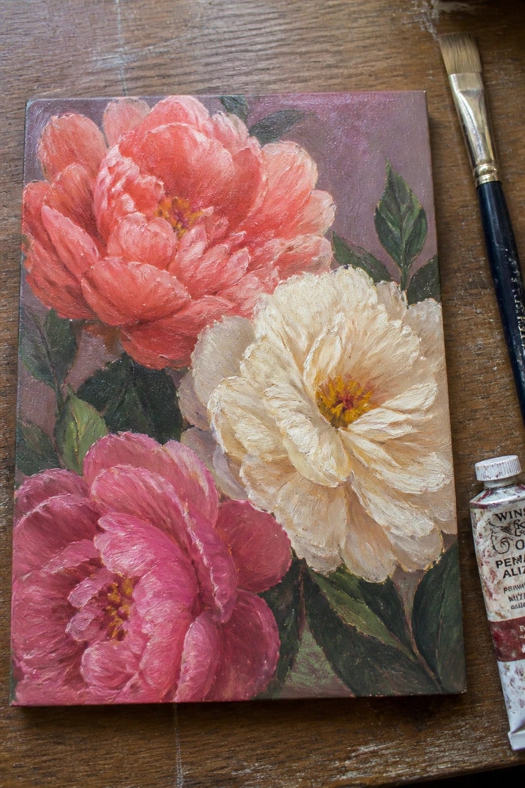 Pink and white peony painting with brush and alizarin crimson tube on wood