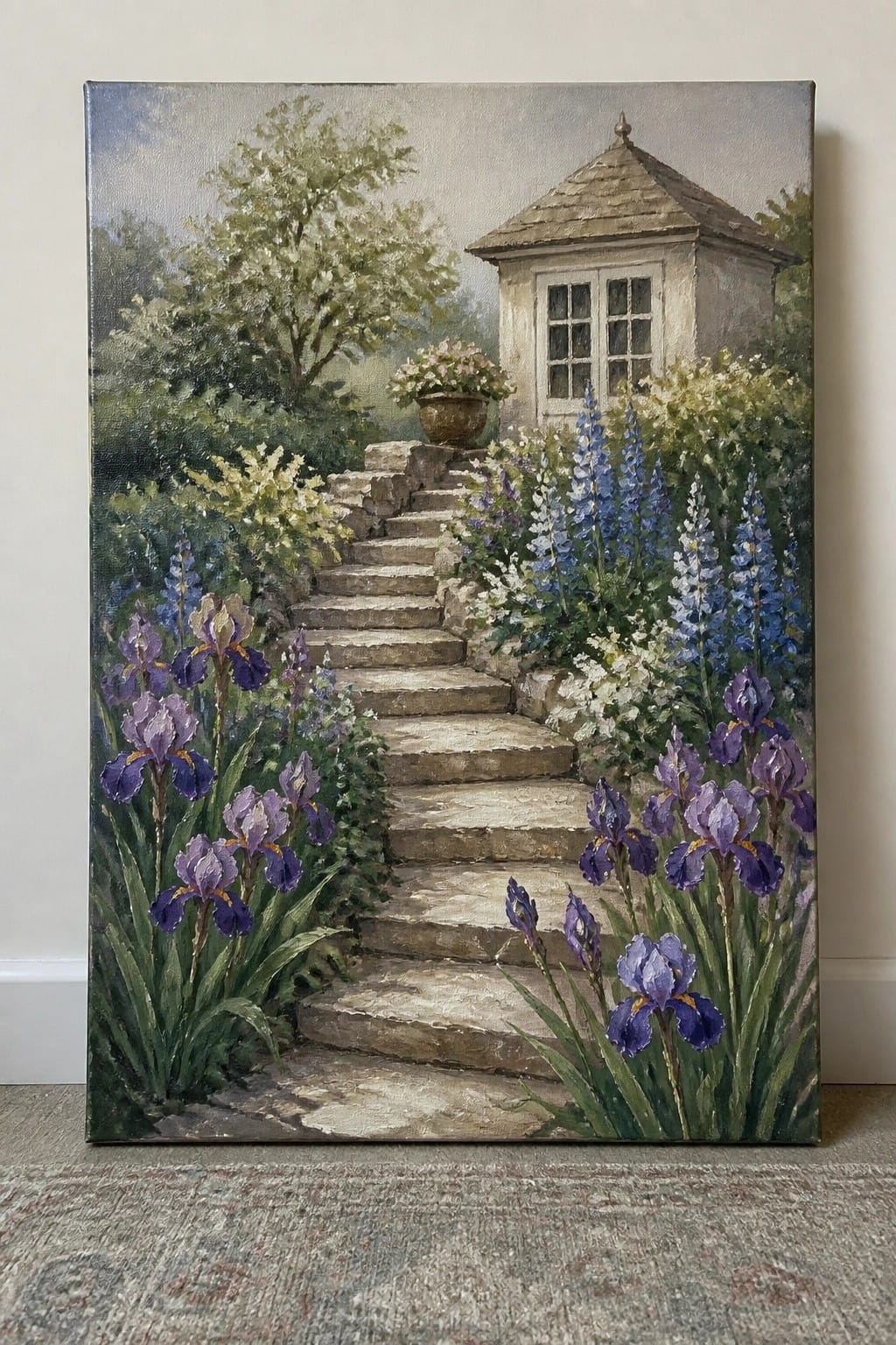 Stone steps lined with purple irises and blue flowers lead to a cottage.