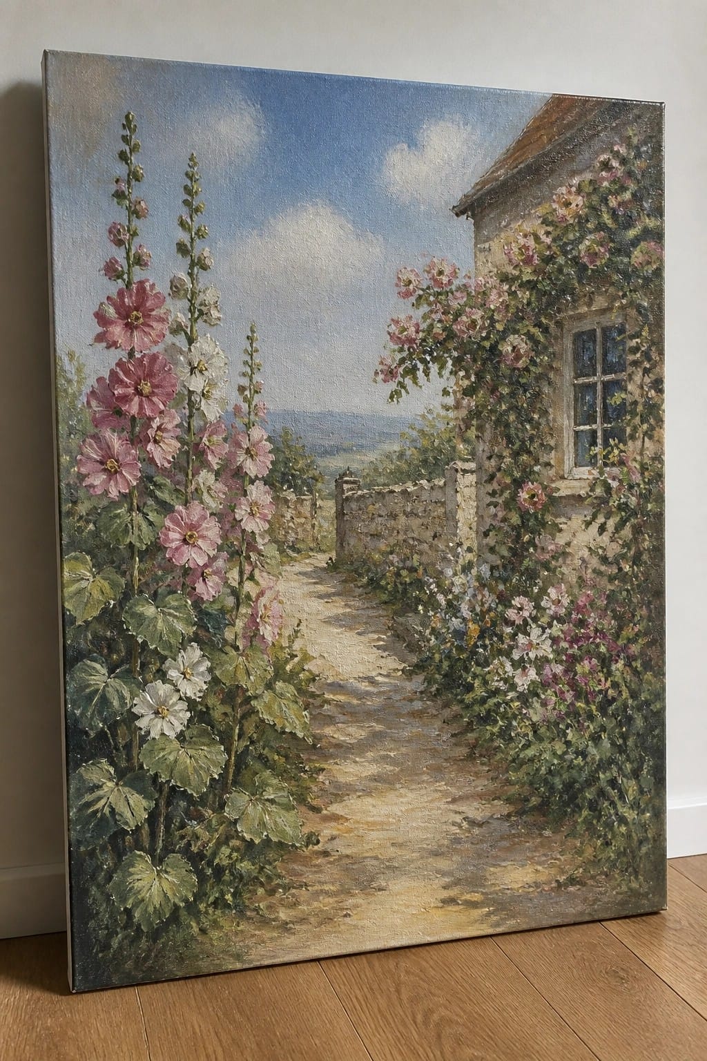 Oil painting of pink hollyhocks lining a path to a rose-covered stone cottage.