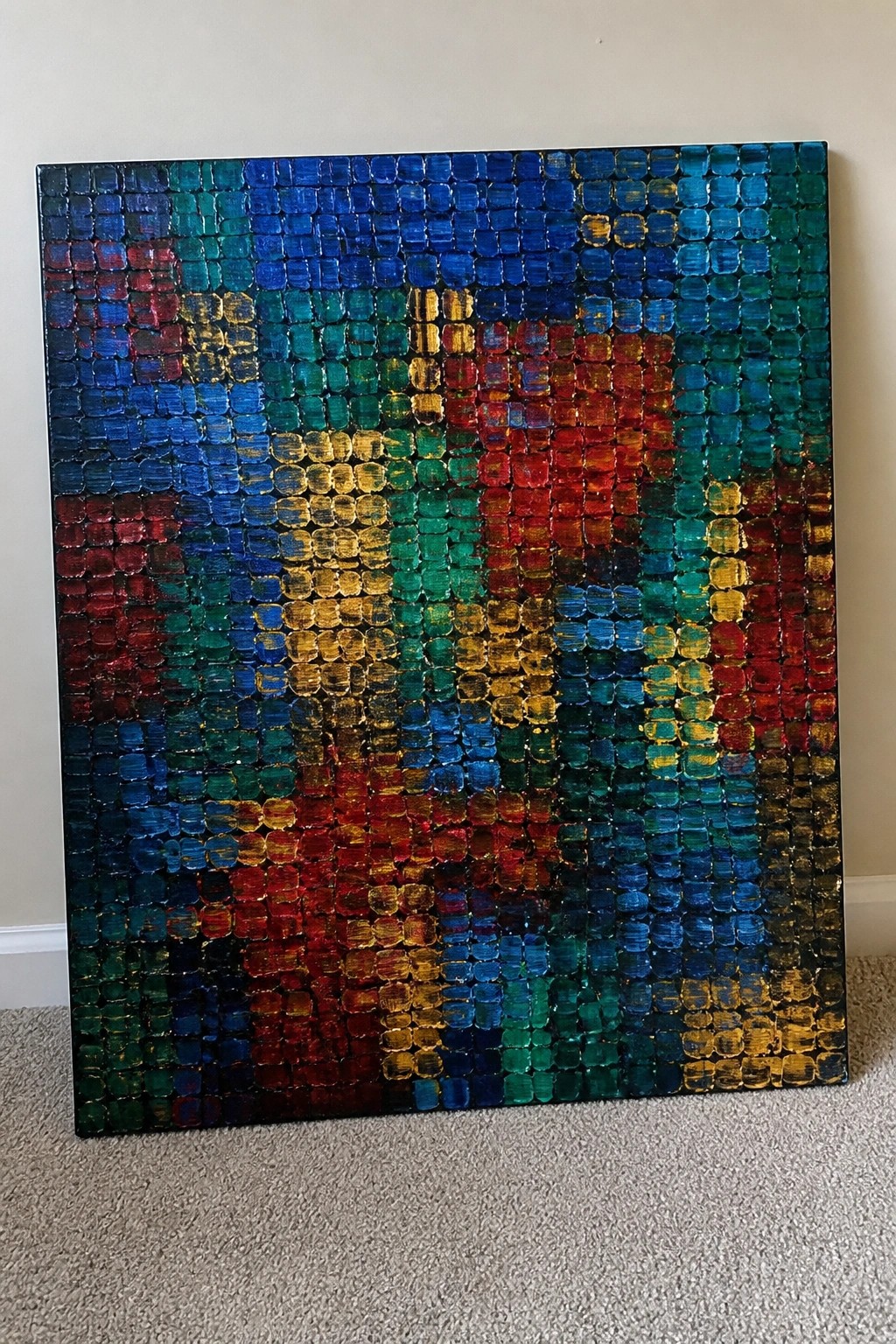Vibrant abstract canvas with textured multicolored grid squares in blue green red yellow