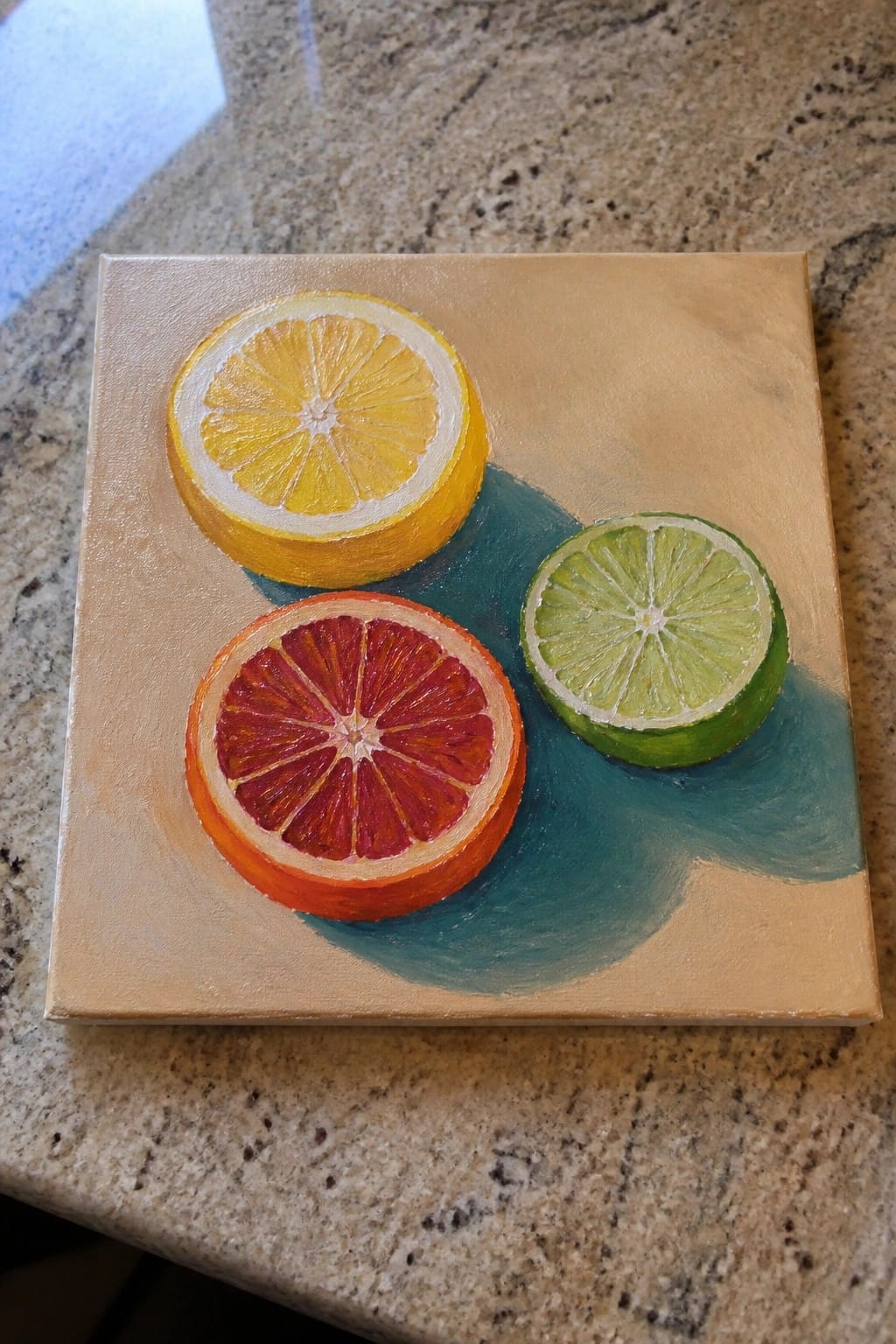 Acrylic painting of lemon, blood orange, and lime slices on beige canvas with teal shadow