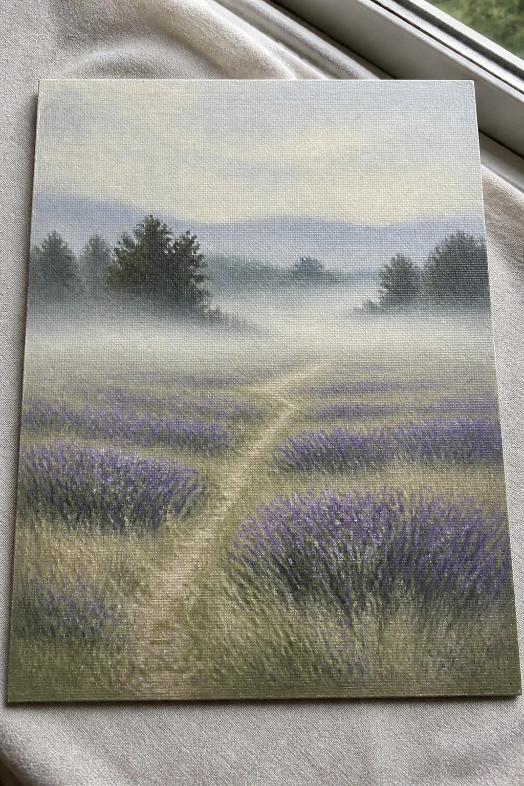 Misty lavender field painting with winding path, fog, and distant trees on canvas.