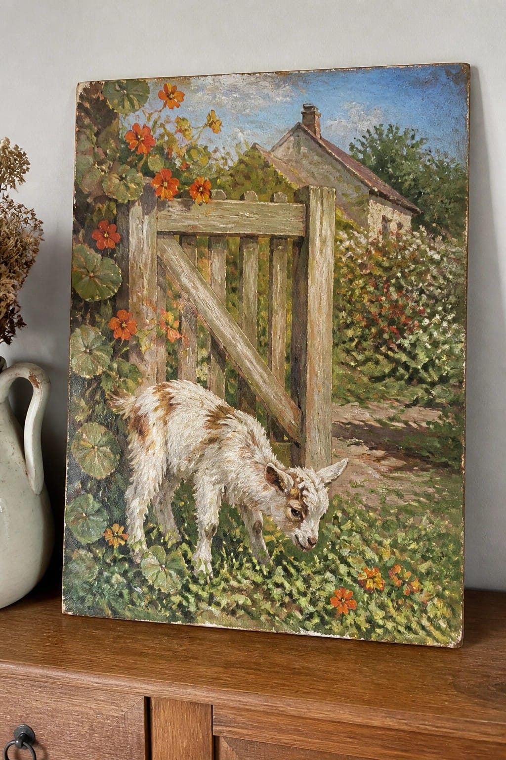 Painting of white-and-brown goat by wooden gate with orange flowers