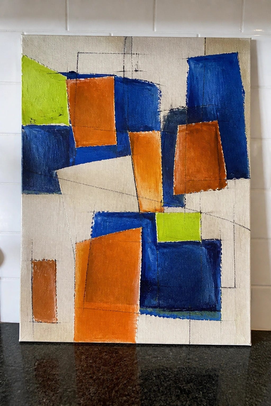 Abstract painting with blue, orange, and lime green geometric shapes on beige canvas.
