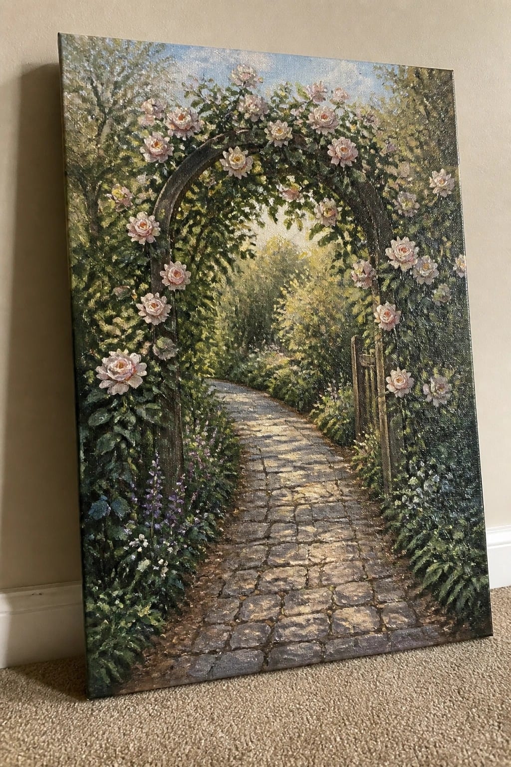Lush garden with cobblestone path beneath blooming rose-covered archway on canvas.