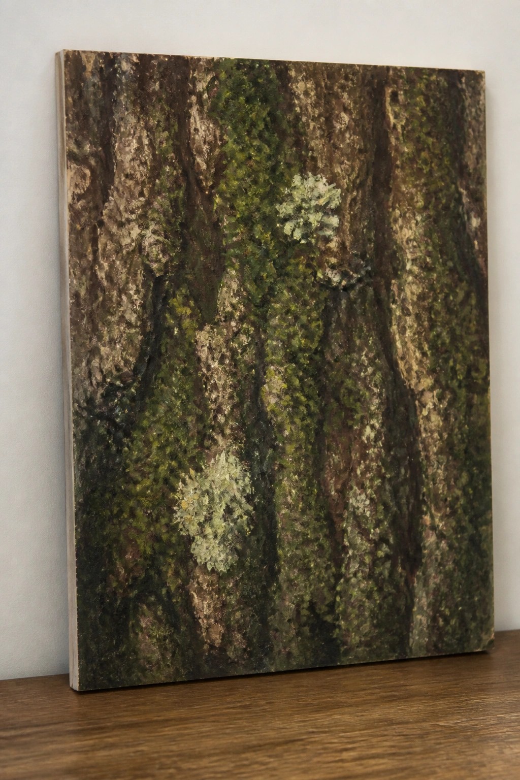 An oil painting of close-up tree trunks covered in green moss and light lichen patches resting on a wooden surface.