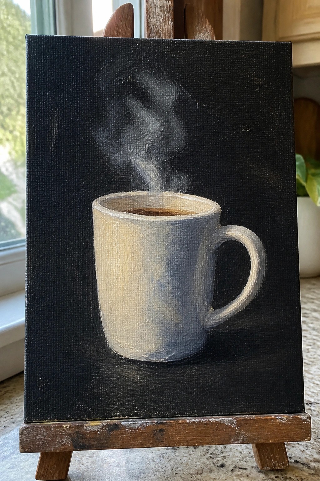 Steaming coffee mug painting on black background, displayed on wooden easel.