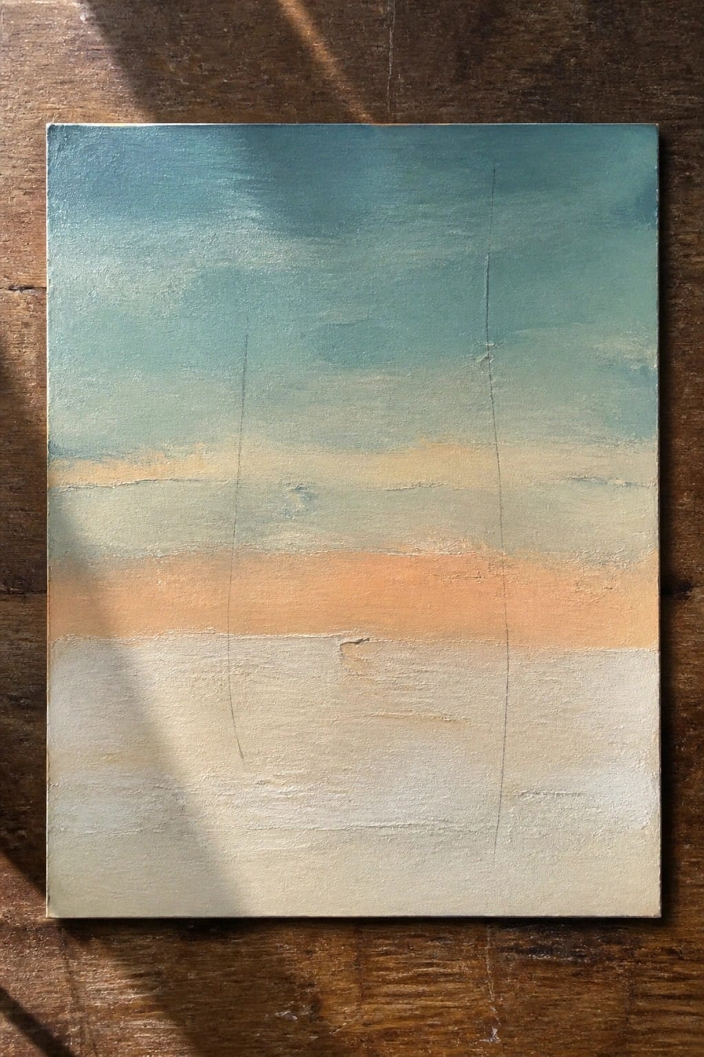 Abstract painting with horizontal bands of teal, peach, and white on wood.