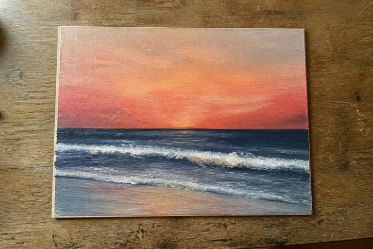 22 Easy Oil Painting Ideas For Beginners You’ll Want To Try Tonight Sunset painting with orange-red sky over dark blue ocean and white waves on wood