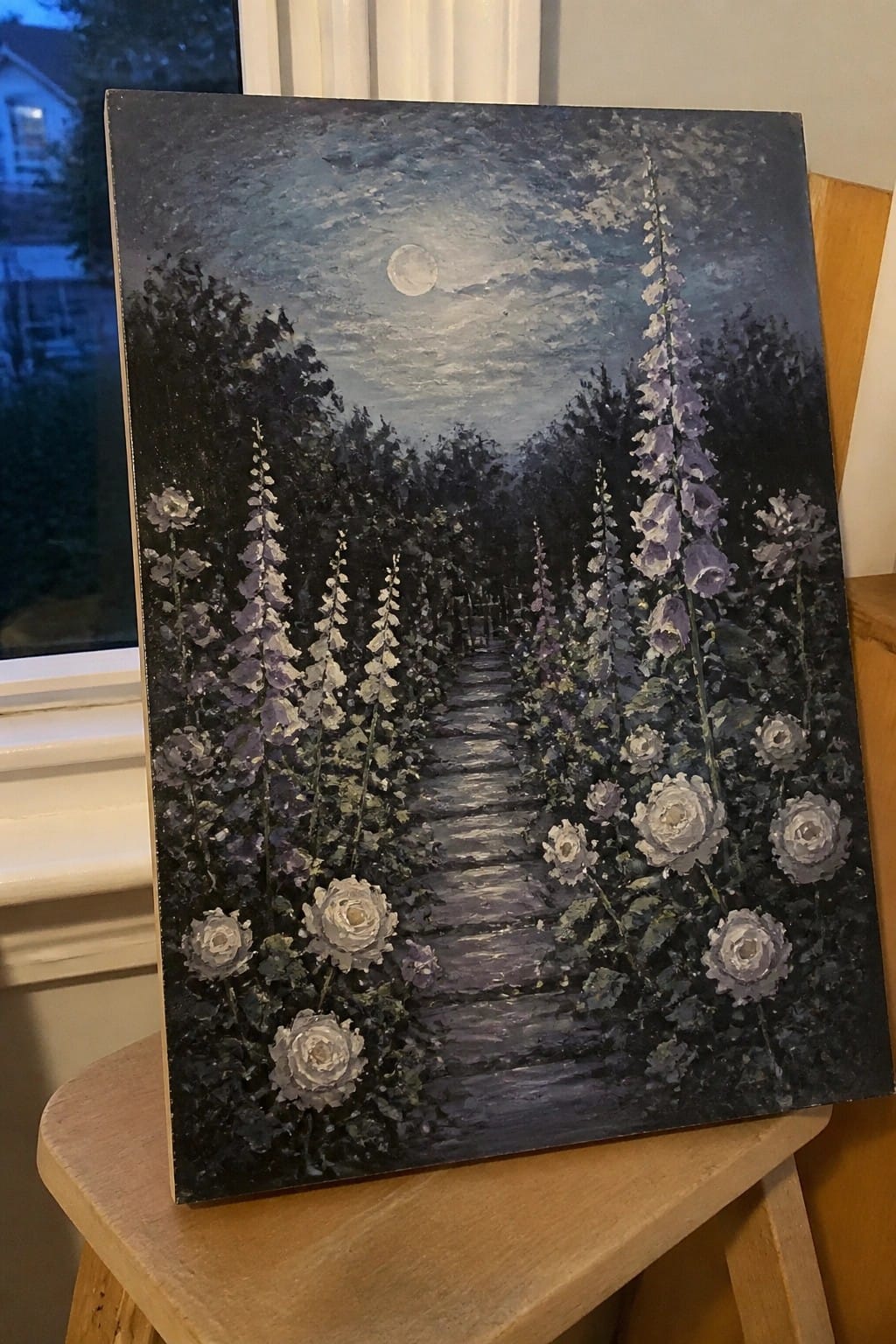 Moonlit garden path lined with purple foxgloves and white roses under full moon