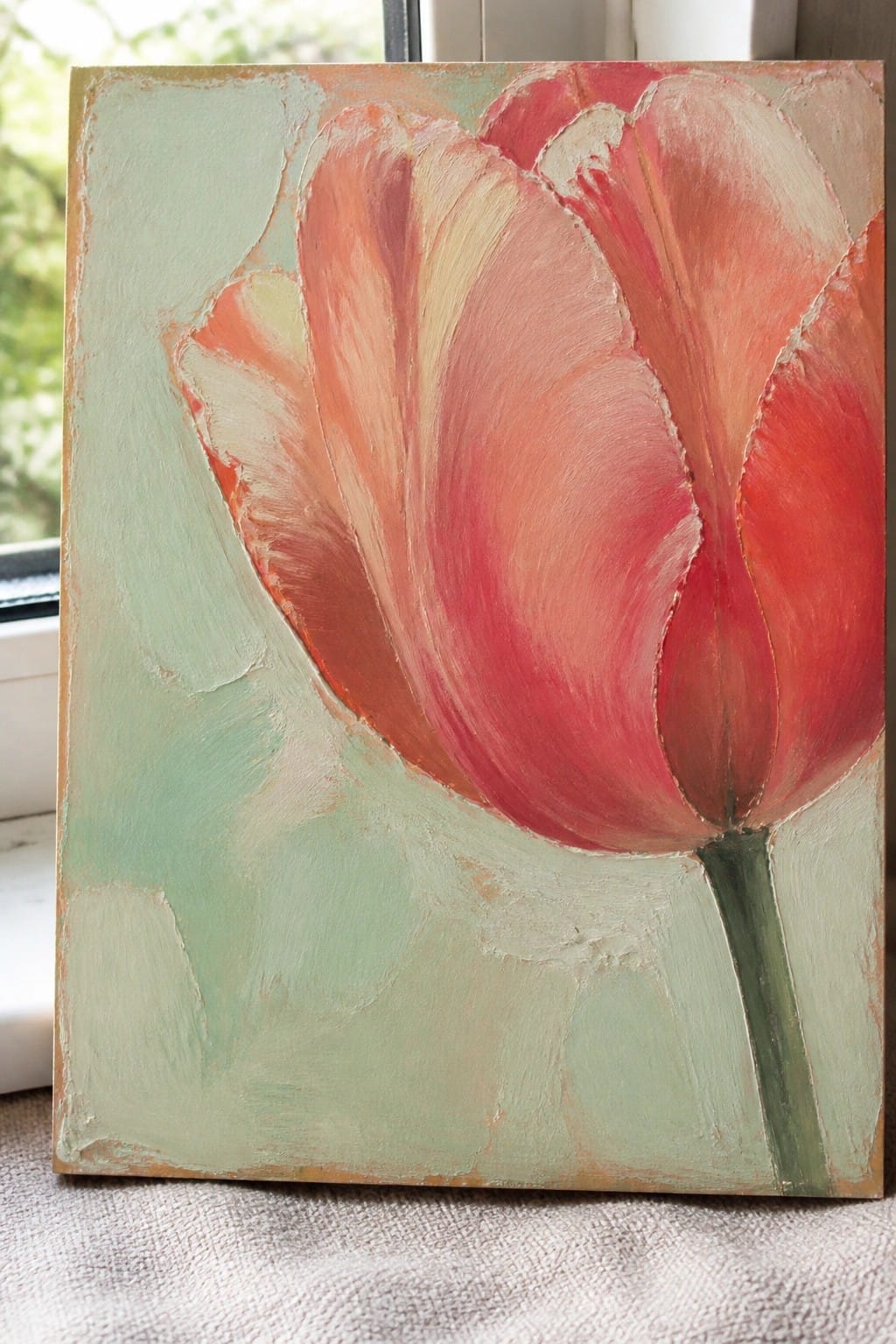 Textured acrylic painting of a vibrant red tulip with green stem on light green background