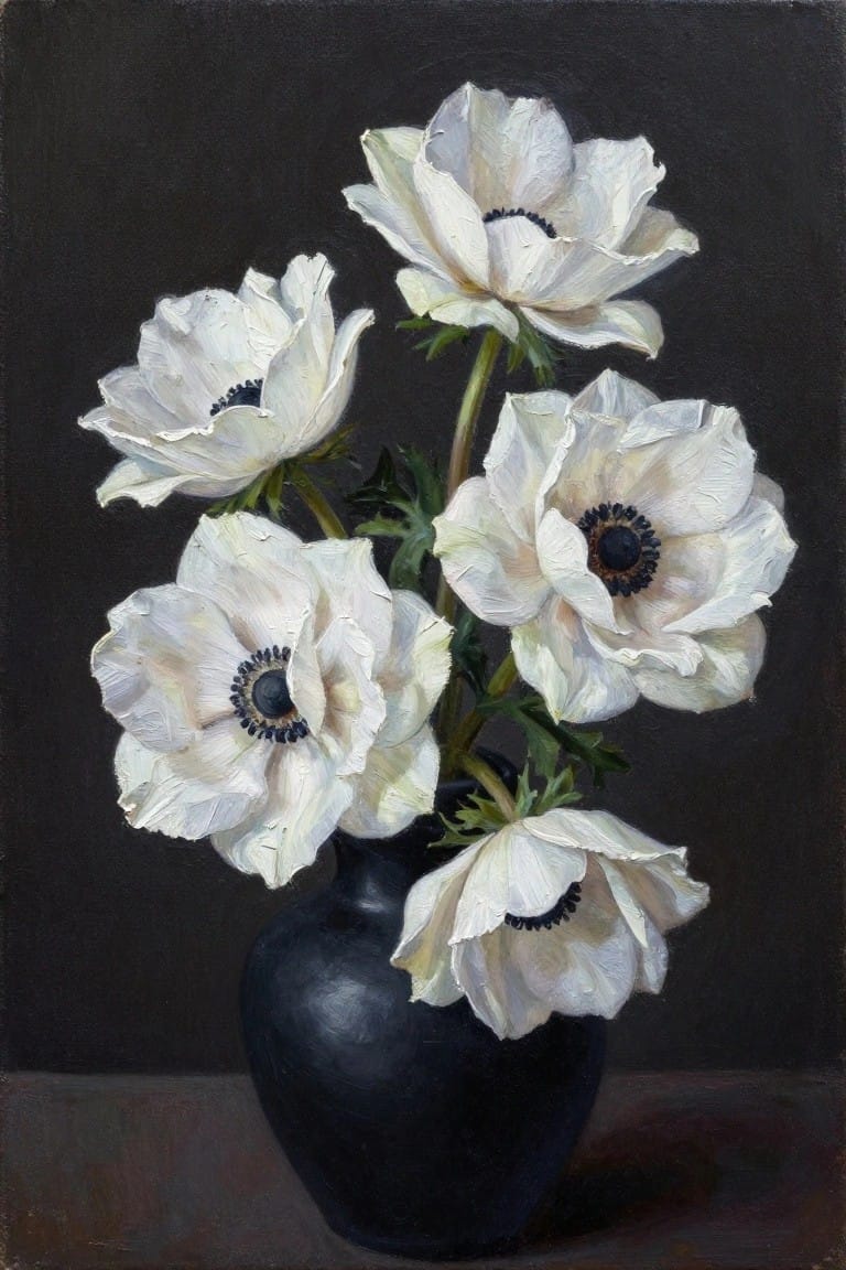 White anemones with dark centers in a black vase against dark backdrop.