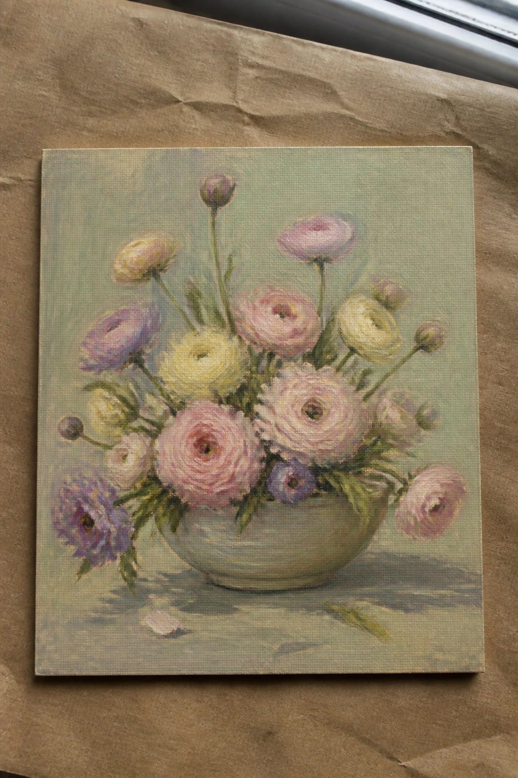 Pastel painting of pink, yellow, and purple flowers in a green vase.