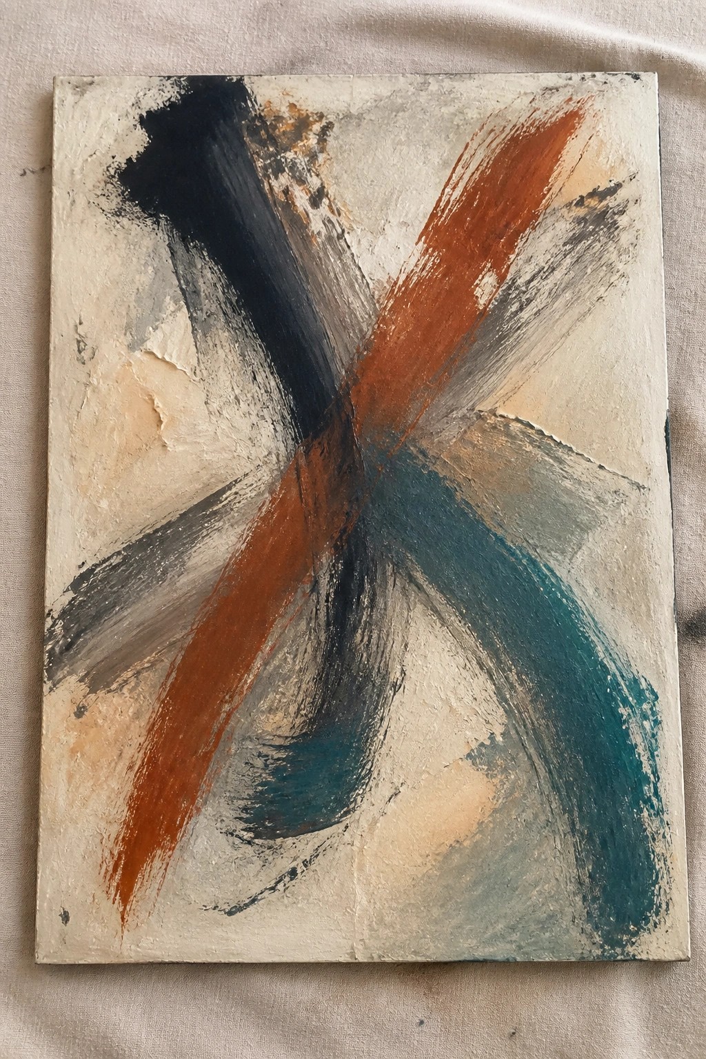 Abstract painting with bold crossing black orange and teal brushstrokes on textured canvas