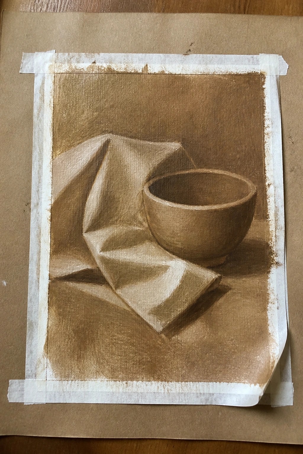 Sepia still life drawing of draped fabric beside a round bowl