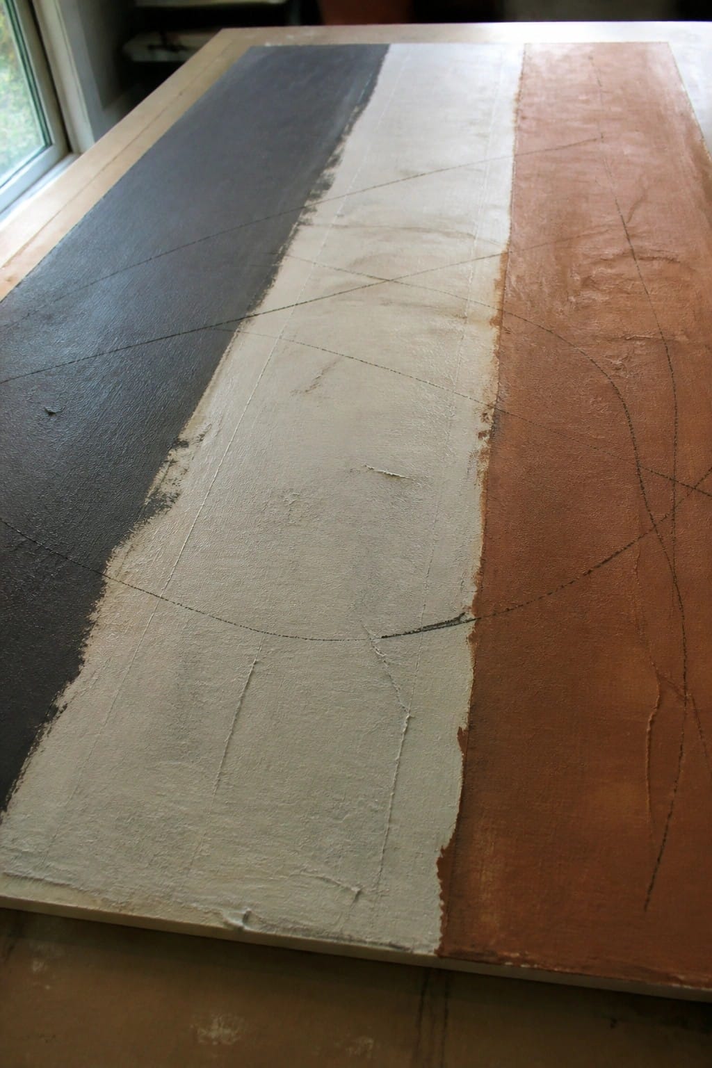Abstract canvas with black, off-white, and rust panels crossed by thin curved lines.