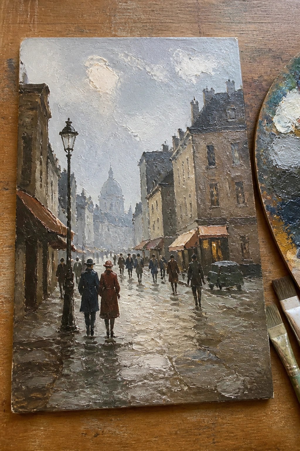 Oil painting of pedestrians strolling on rainy cobblestone street with lamppost, buildings, and vintage car.