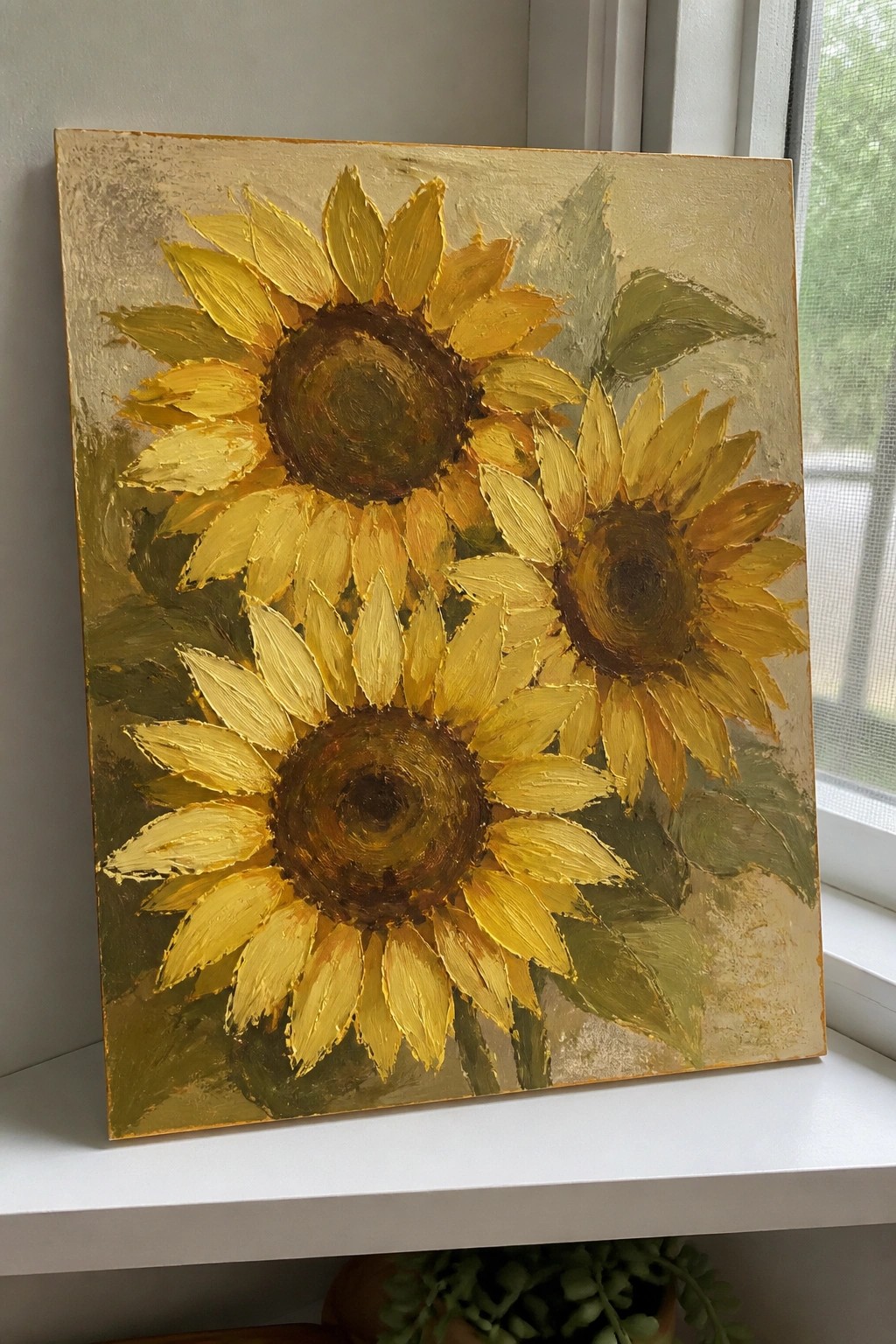 Impressionistic painting of three yellow sunflowers with brown centers on gold background