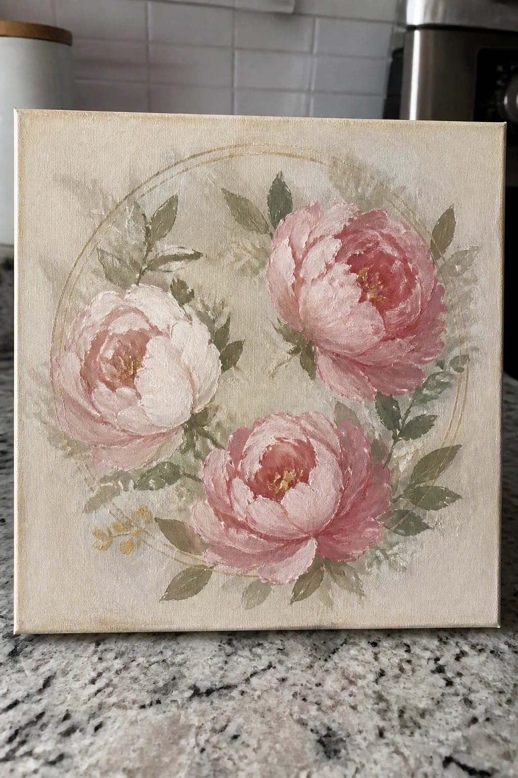Three pink peonies with green leaves in a gold circle on canvas