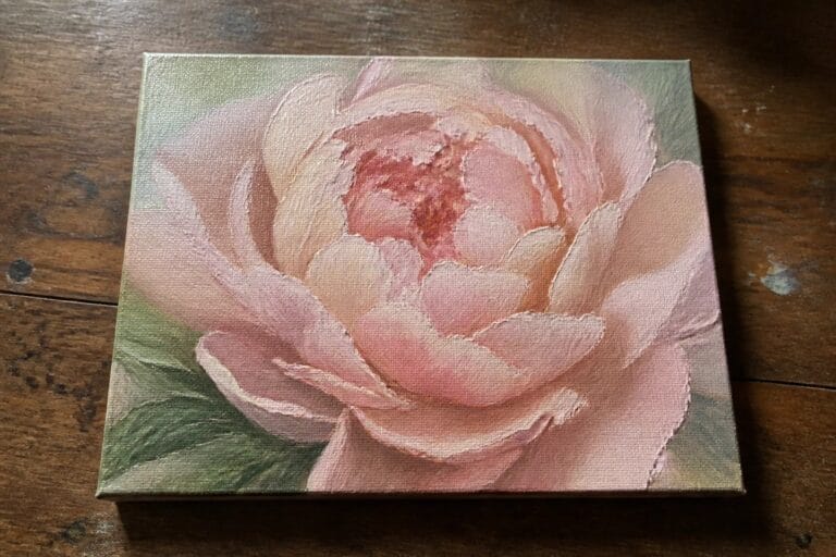22 Romantic Peony Flower Oil Painting Ideas Featuring Layered Petals and Soft Color Square canvas with blooming pink peony painting on dark wooden table