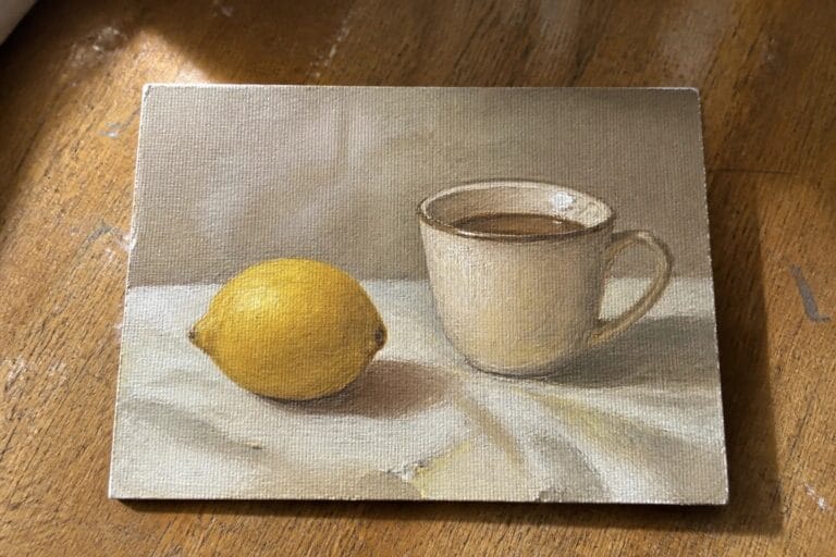 22 Simple Oil Painting Starter Guides For New Artists Realistic oil painting of yellow lemon beside white mug on draped cloth with shadows