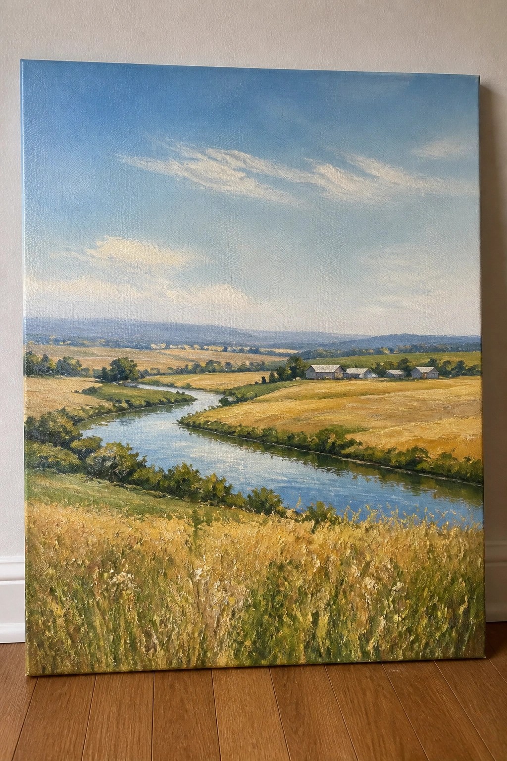 Oil painting of winding river through golden fields with farm buildings under blue sky.