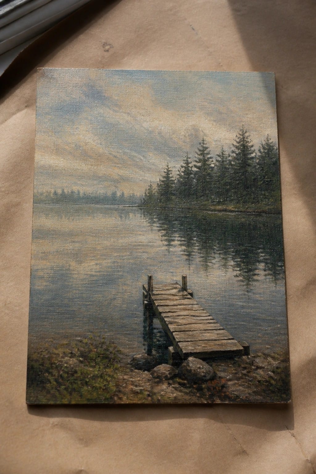 Oil painting of wooden dock extending into calm lake with pine trees and reflections.