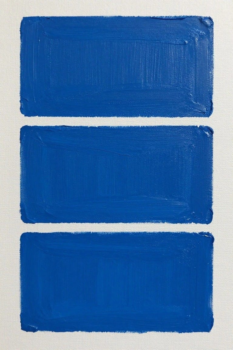 Three horizontal blue brushstrokes stacked on white canvas with visible texture.