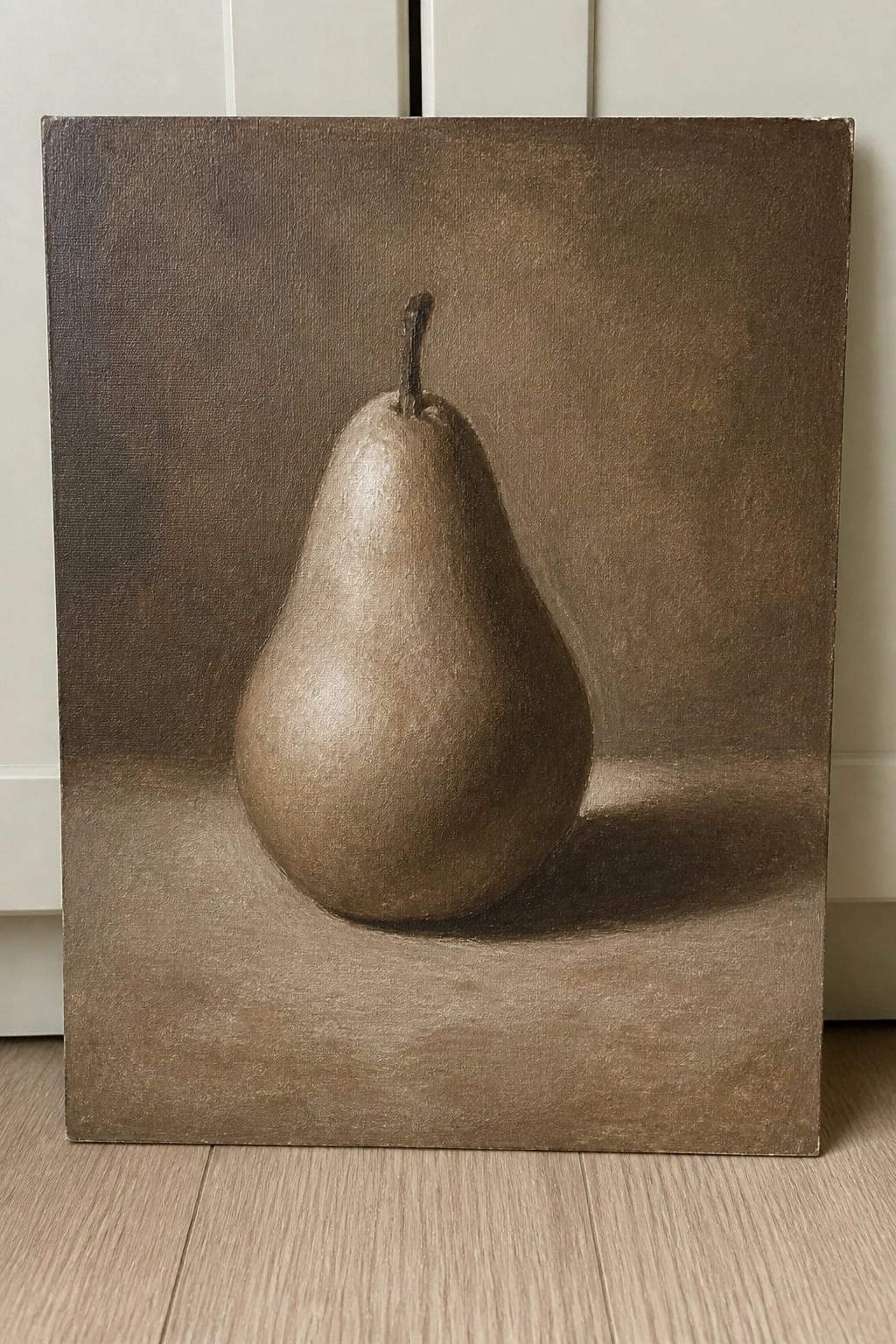 Realistic brown-toned painting of a single pear with stem and cast shadow.