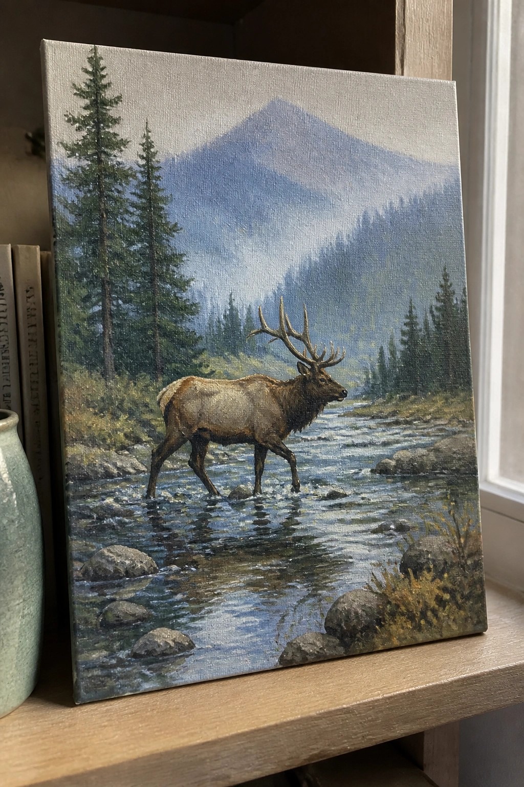 Oil painting of large antlered elk wading through rocky mountain river with pines.