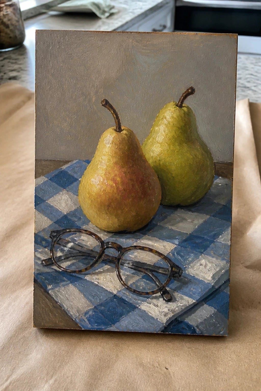 Two pears and tortoiseshell glasses on blue checkered cloth in oil painting