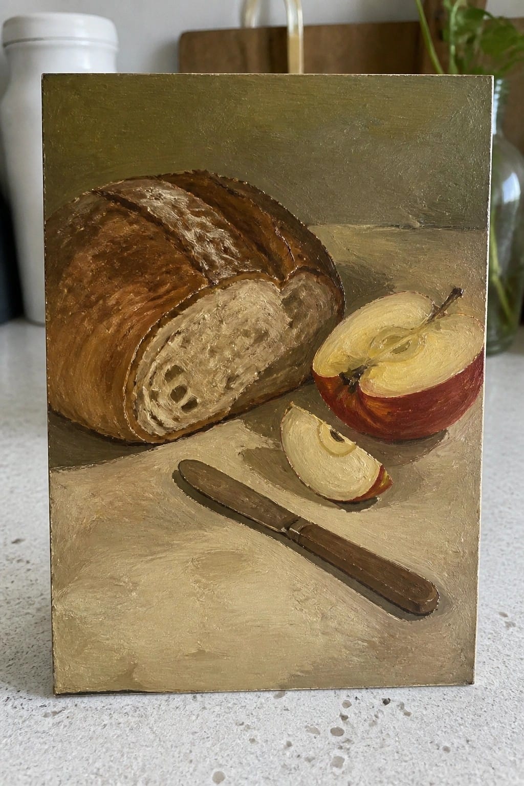 An oil painting of a sliced loaf of bread, a whole red apple, an apple slice, and a knife on a golden surface.