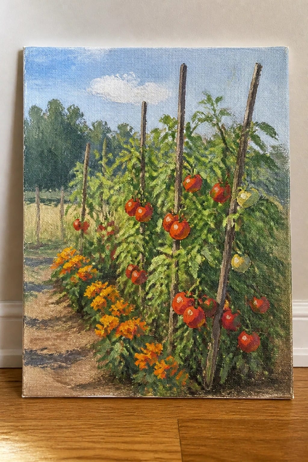 Oil painting of tomato plants with ripe red fruit on wooden stakes amid orange flowers