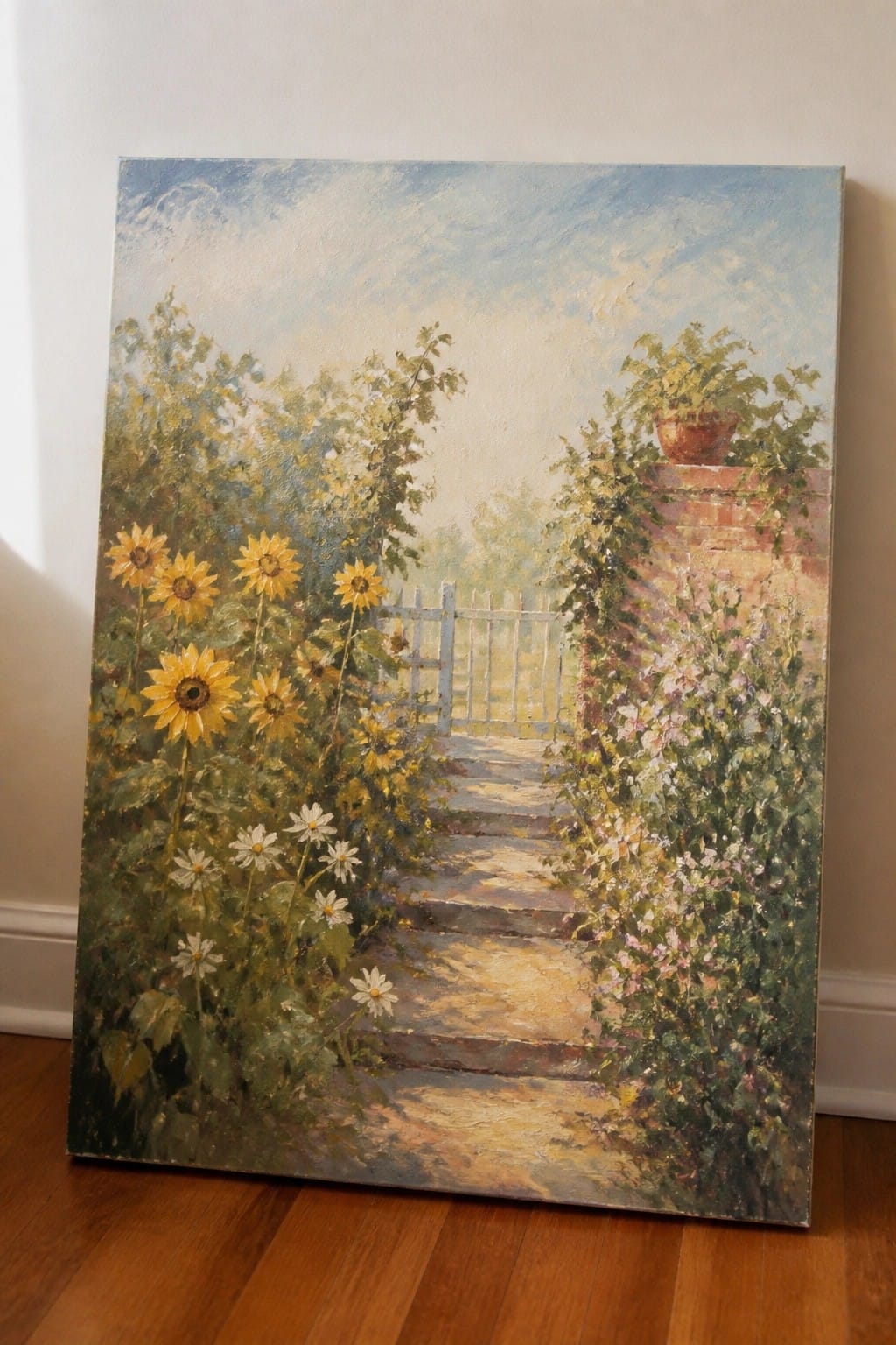 Oil painting of sunlit stone path with sunflowers, daisies, and flowers to white gate