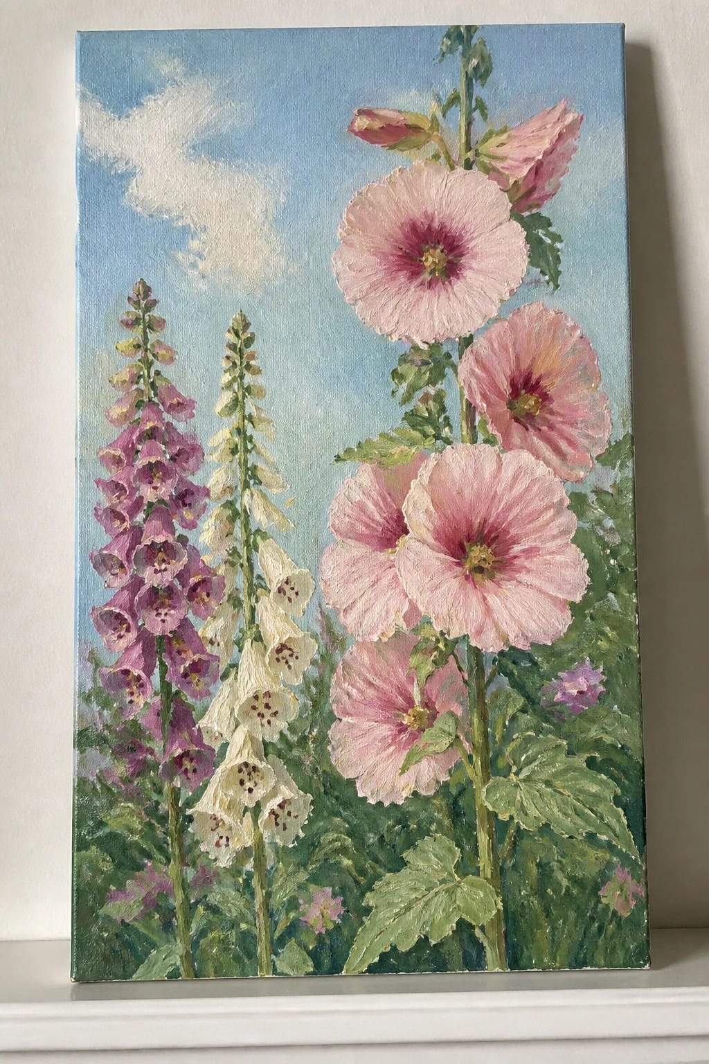 Oil painting of pink hollyhocks and purple foxgloves against a blue sky