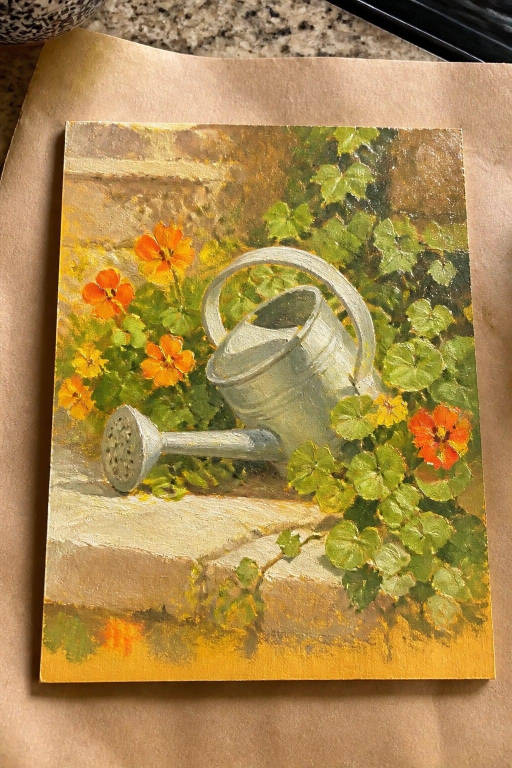 Painting of silver watering can amid orange flowers and green leaves on stone ledge