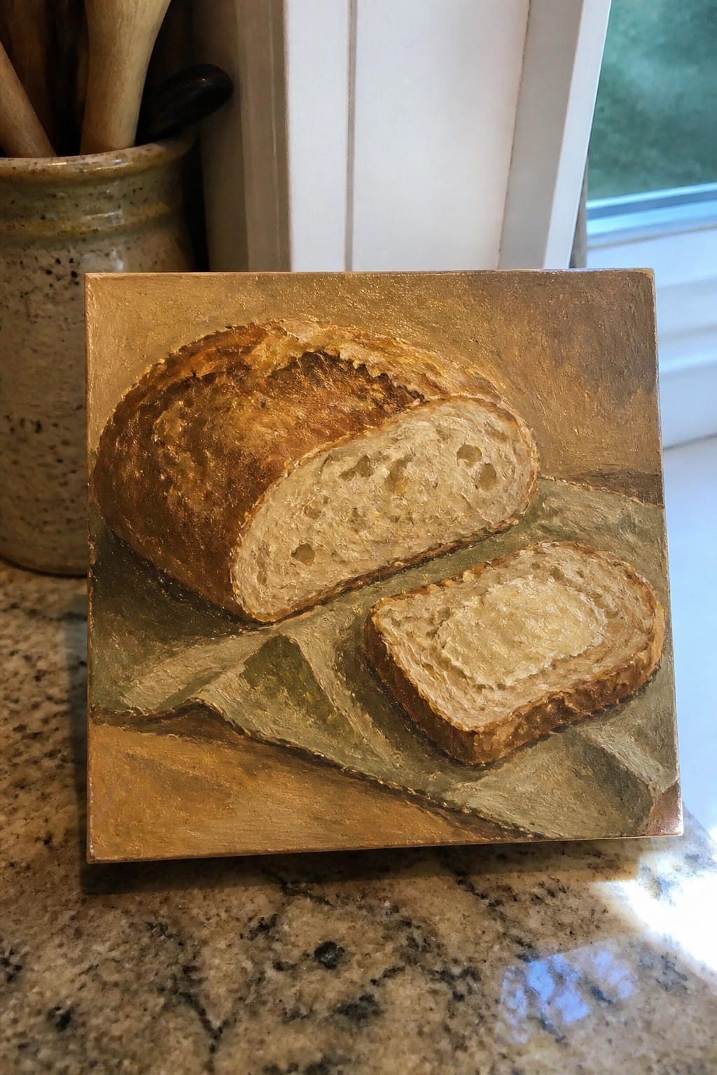Painting of crusty bread loaf and slice on golden-green textured background.